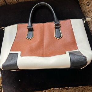 Brown, black, tan pocketbook